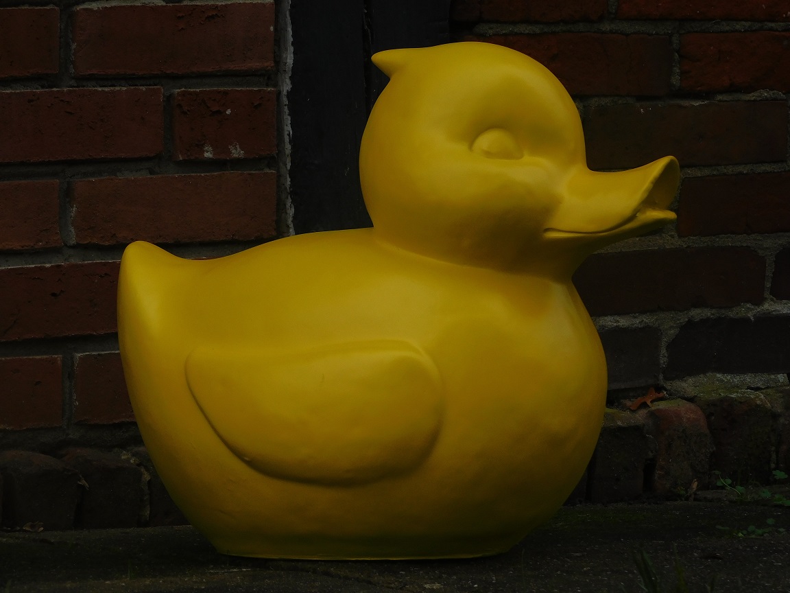 Sizeable duck as piggy bank - bright yellow - polystone