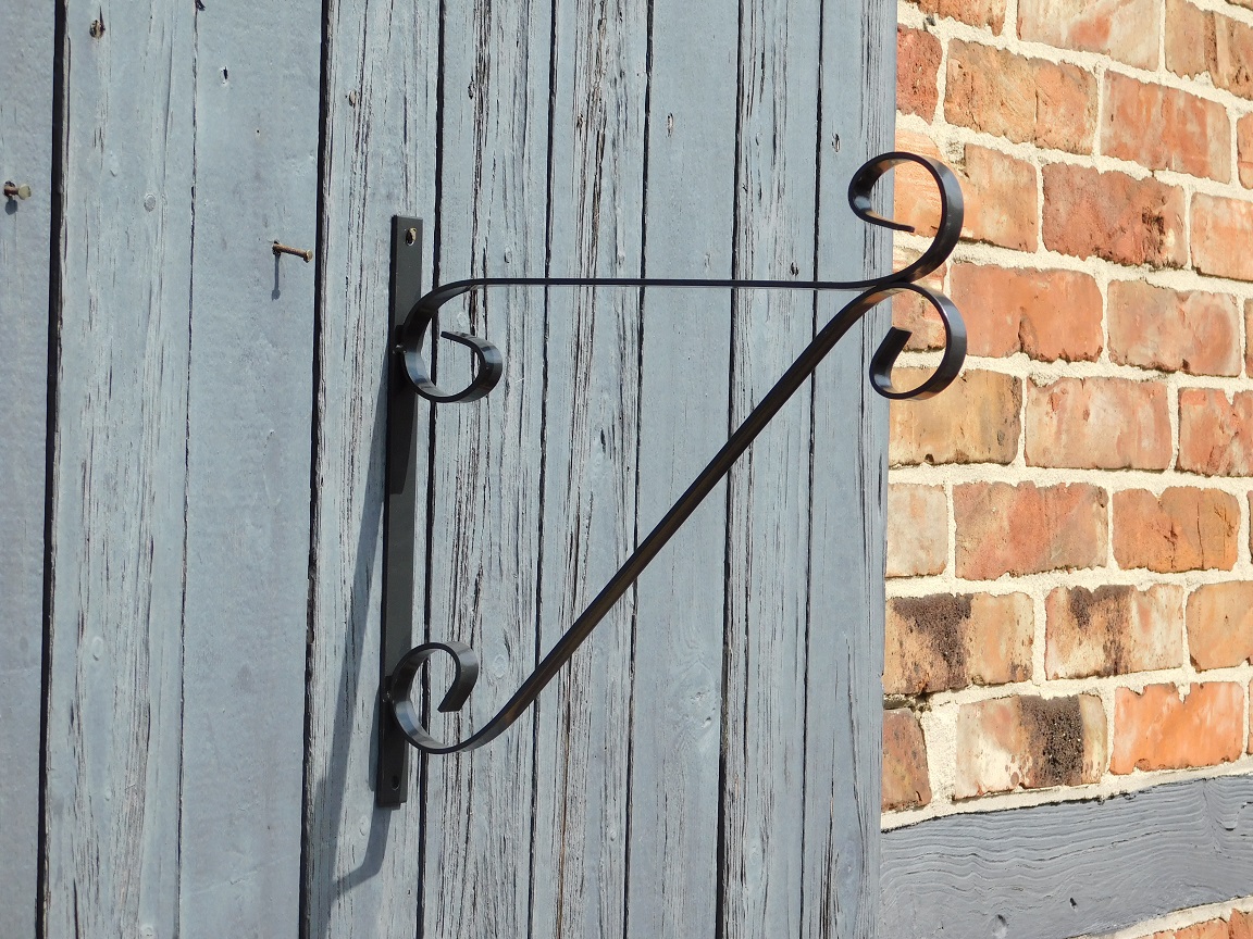 Decorative wall hook with curl - hanging basket hook