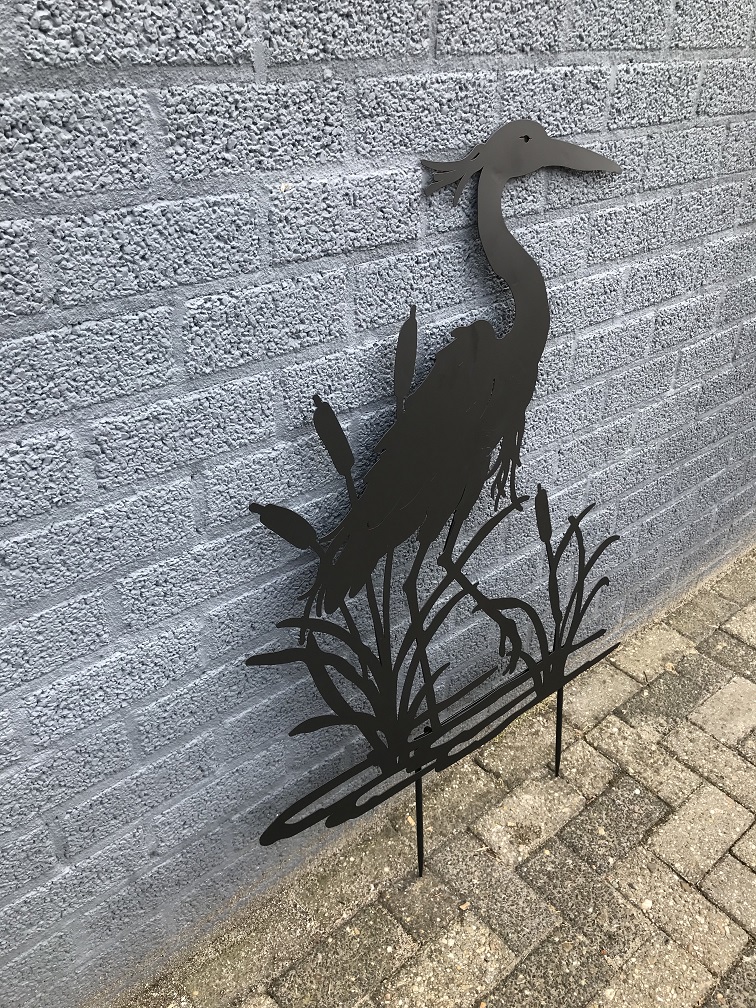 A silhouette of a heron, matte black