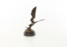 A bronze statue/sculpture of a stork figure