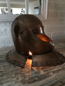 Knight's helmet copper, with folding visor.