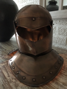 Knight's helmet copper, with folding visor.