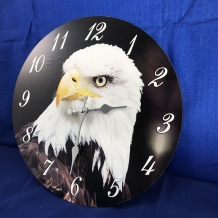 Wooden clock with an image of an eagle.