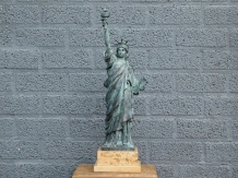 A bronze statue/sculpture of ''THE STATUE OF LIBERTY''