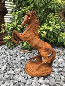 A beautiful statue of a rearing horse, cast iron rest