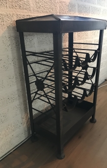 An antique wine rack, metal wine holder for 9 bottles of wine