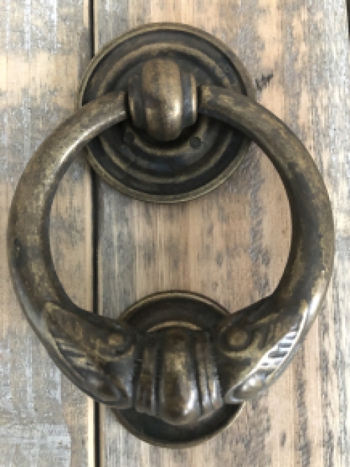 Door knocker, stylish and antique dark brass.