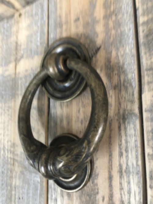 Door knocker, stylish and antique dark brass.