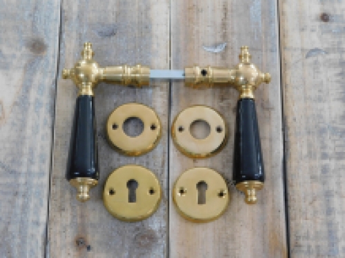 Set of door handles with rosettes - polished brass - with black ceramic handles