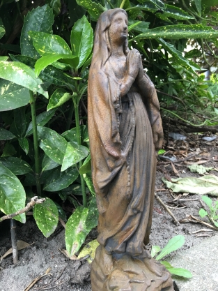 Statue of Mary full of stone, beautiful in detail, oxide color