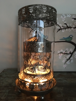 Beautiful metal lantern with separate rotating fire hood and cut glass.