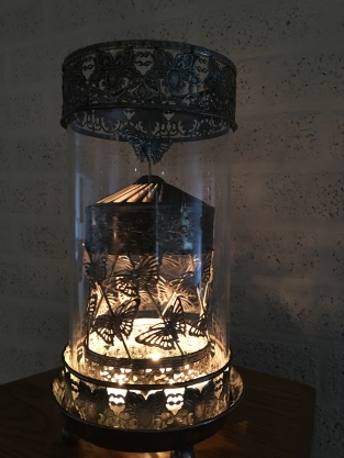 Beautiful metal lantern with separate rotating fire hood and cut glass.