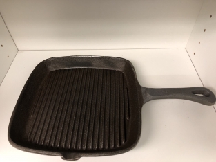 Heavy cast-iron grill pan, old-fashioned top quality.