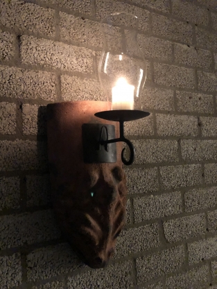 Wind light of roof tile with mythical image, with candlestick and glass flask.