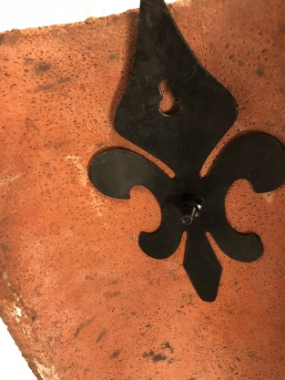 Wind light from roof tile with mythical image, with candlestick.