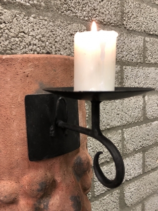 Wind light from roof tile with mythical image, with candlestick.