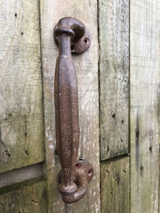 Door handle round-base made of solid iron - large- rust brown coated.