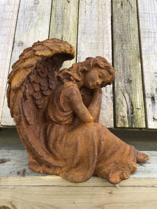 Beautiful seated angel, full of detail, cast iron rest