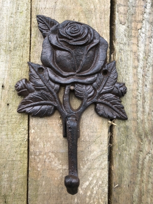 Coat rack with a rose, coat rack in cast iron, antique, brown