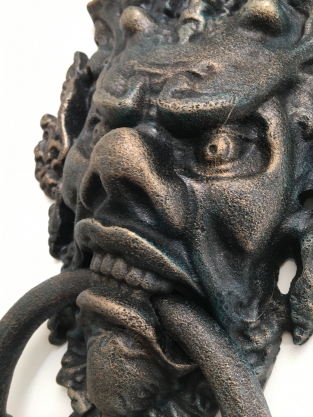 Cast iron door knocker with devil's head, very distinctive and beautiful!