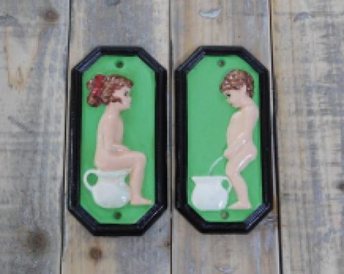 Set of signs for toilet door, cast iron painted, Man +Woman.