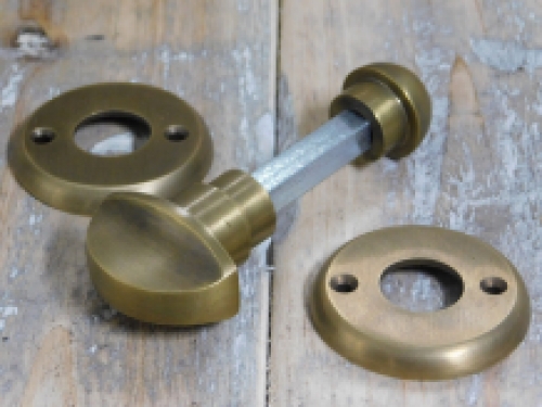 Toilet door hardware, twist lock, brass patinated