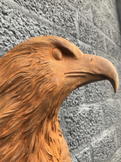 Eagle's head, cast iron wall ornament with rustic surface