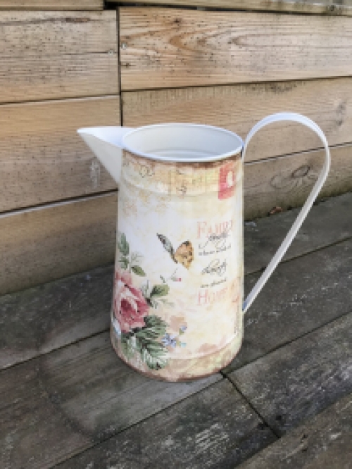 Large jug with beautiful images, made of metal