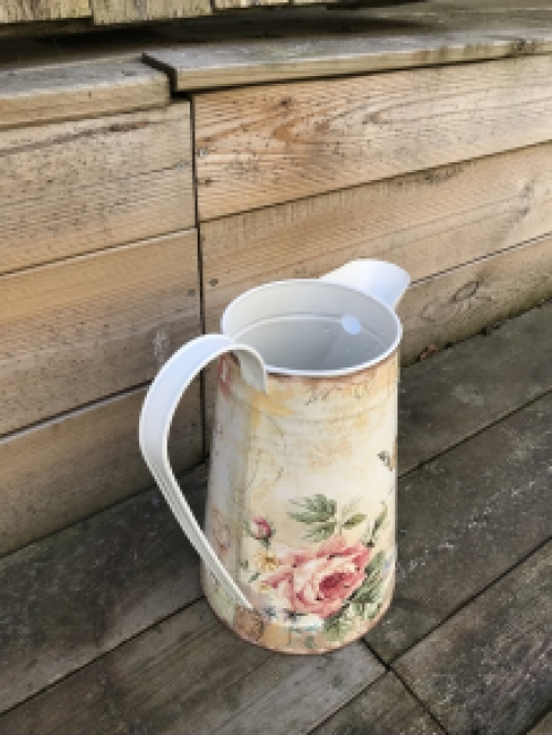 Large jug with beautiful images, made of metal