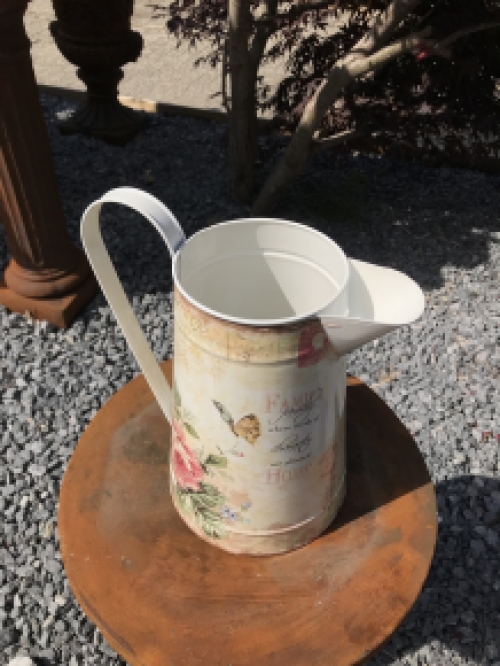 Large jug with beautiful images, made of metal