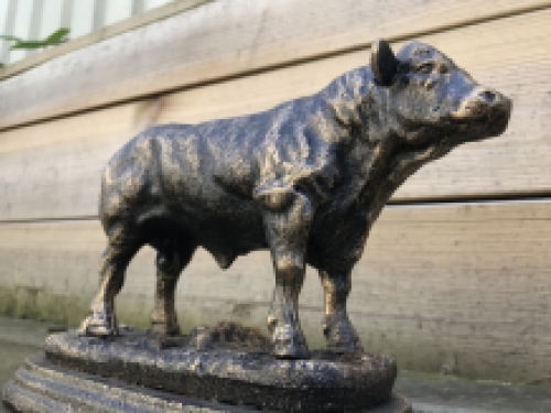 A beautiful statue of a bull, made of cast iron