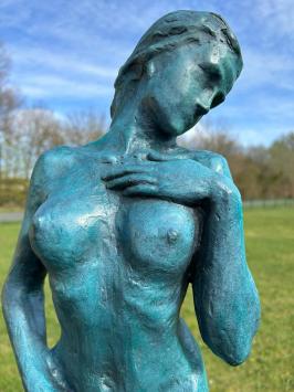 Elegant blue bronze statue of a nude woman on marble base