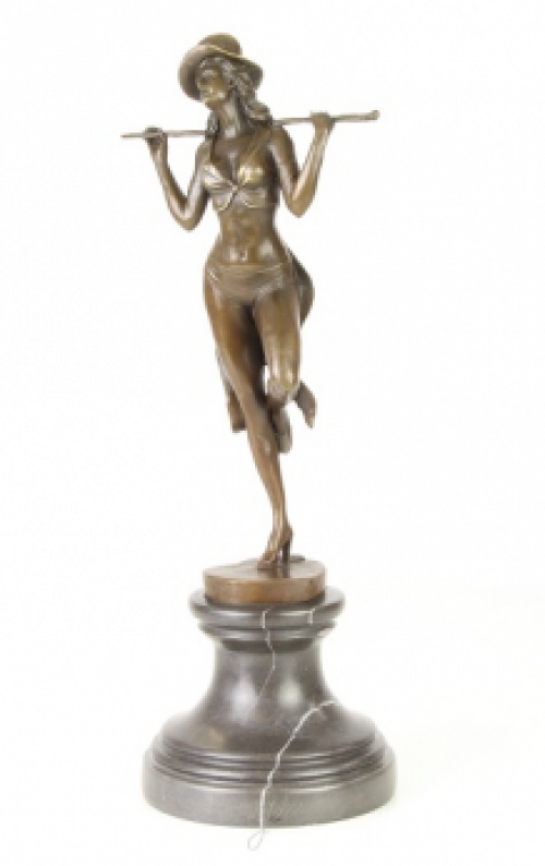 A bronze statue/sculpture of a theater dancer