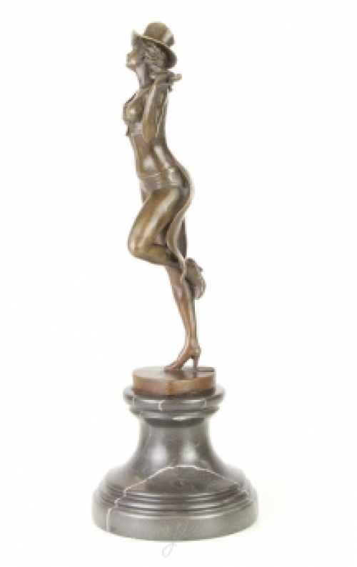 A bronze statue/sculpture of a theater dancer