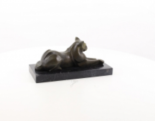 A bronze statue/sculpture of a lying cat, modernist style