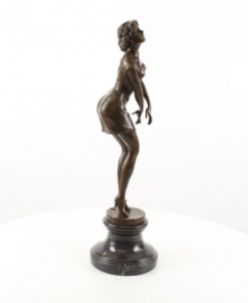 A bronze statue/sculpture of a pensive woman