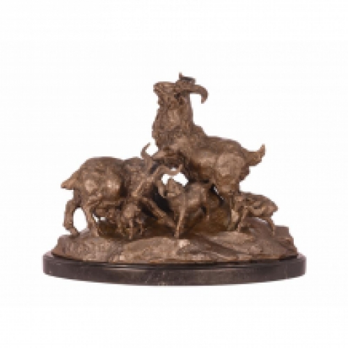 A bronze statue/sculpture of a family of goats