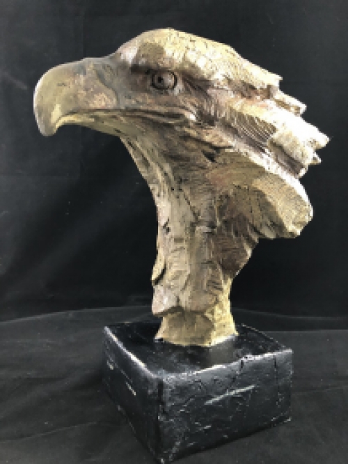 A beautiful head of an eagle, beautiful in detail, polystone wood look