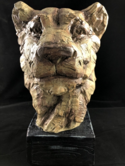 A beautiful head of a lion, beautiful in detail, polystone wood look