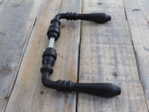 Door hardware set with 2 handles, 2 rosettes and a mandrel, dark brown