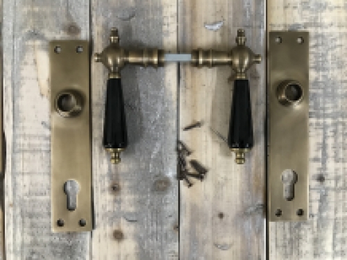 Door hardware set - brass patinated door plates and levers with ceramic handles