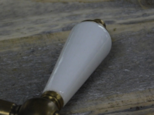 1 deurknop messing met wit keramisch handvat, met inbegrip van doorn
