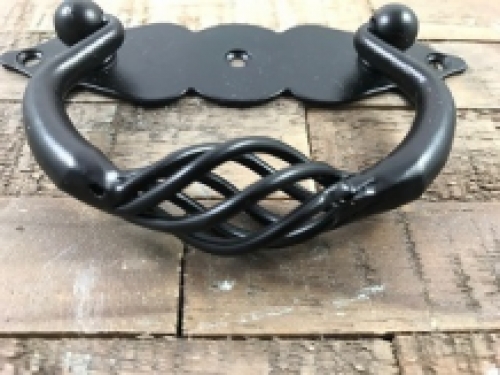 A door handle made of wrought iron, with beautifully turned handle, matt black