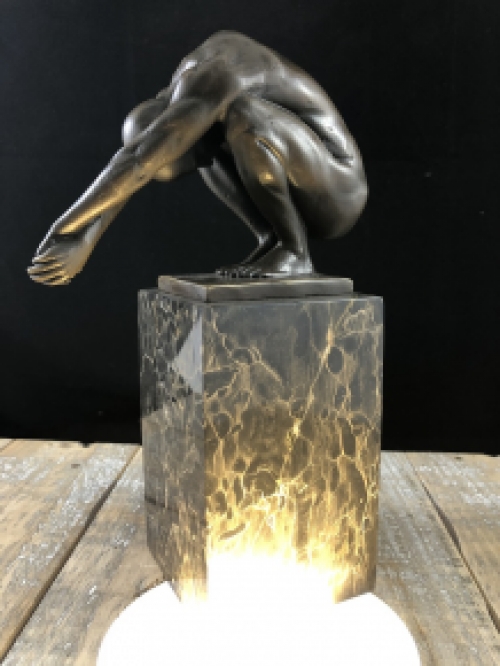 A bronze statue/sculpture of a diving man, ''THE DIVE''