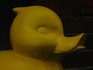 Sizeable duck as piggy bank - bright yellow - polystone