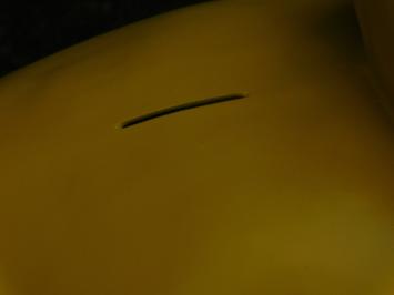 Sizeable duck as piggy bank - bright yellow - polystone