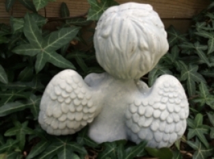 Small sitting Angel made of solid stone, beautiful to see!!