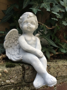 Small sitting Angel made of solid stone, beautiful to see!!