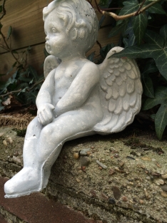 Small sitting Angel made of solid stone, beautiful to see!!