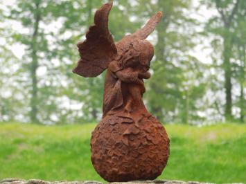 Angel on globe - cast iron